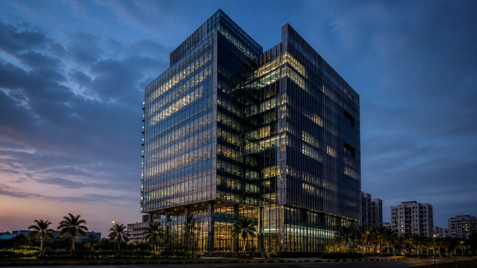 Modern commercial real estate building at twilight with glass facade